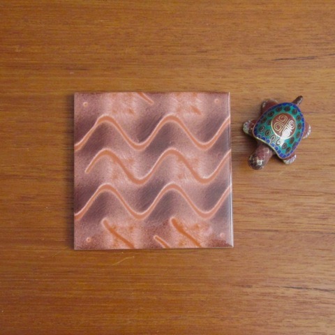 This brown tile has an abstract that looks like drizzled caramel. Gingezel at Zazzle.